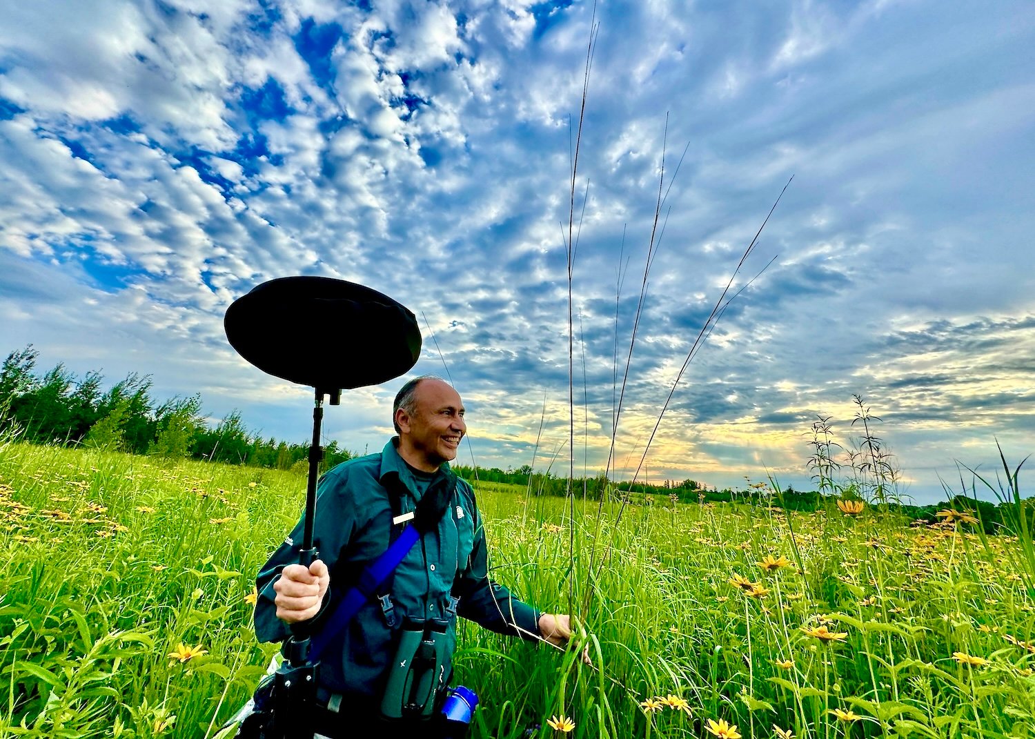 Parks Canada ecologist Leonardo Cabrera takes a soundscape recording in an off-limits area of Rouge National Urban Park frequented by rare Bobolinks.