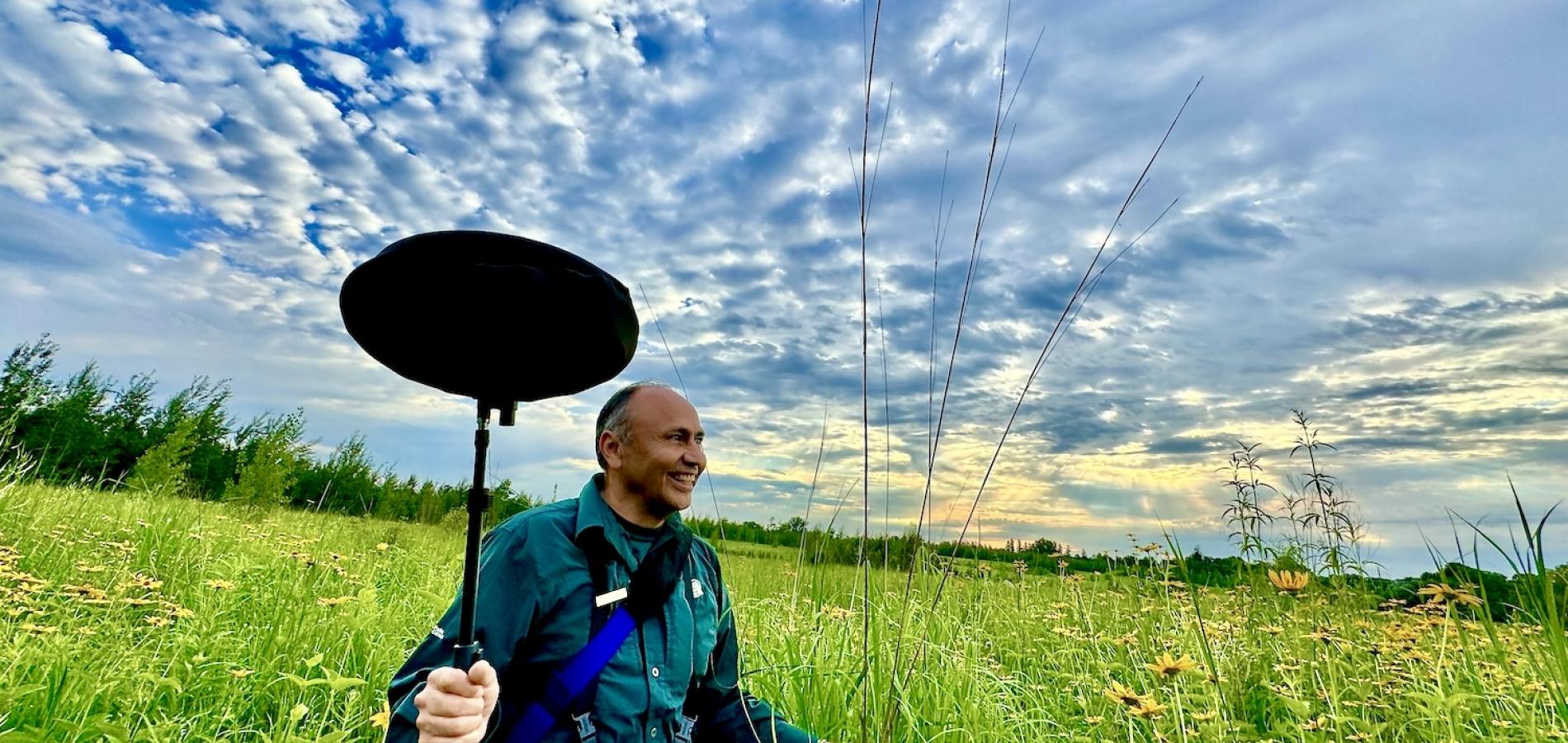 Parks Canada ecologist Leonardo Cabrera takes a soundscape recording in an off-limits area of Rouge National Urban Park frequented by rare Bobolinks.