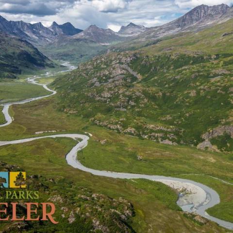 An image of a stream winding through a valley at Wrangell-St. Elias National Park and Preserve