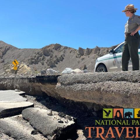 A park ranger inspects road damage from flooding at Death Valley National Park