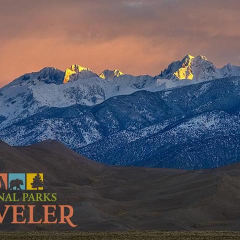 A telephoto sunrise over the mountains at Great Sand Dunes National Park by Rebecca Latson