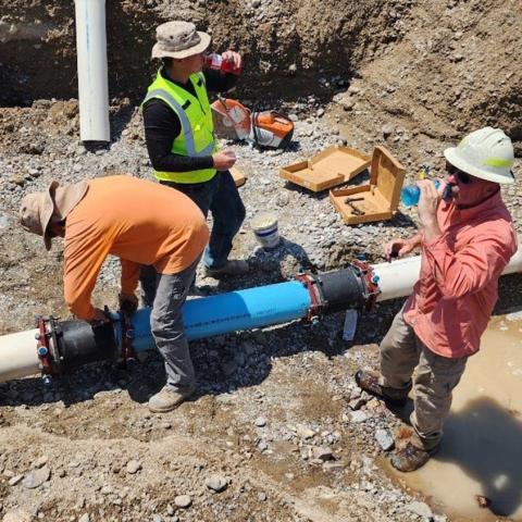 Workers fix broken pipes at Death Valley National Park. NPS photo.