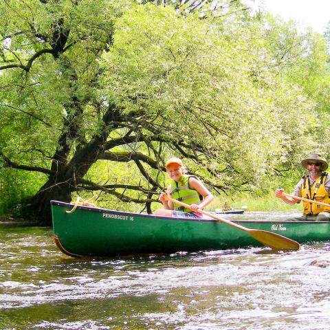 Two canoes paddling down the the Namekagon River at SACN. NPS Photo.