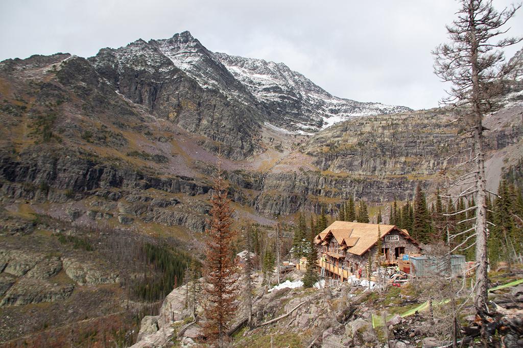 Chalet building on a cliff in a mountain range, Glacier National Park