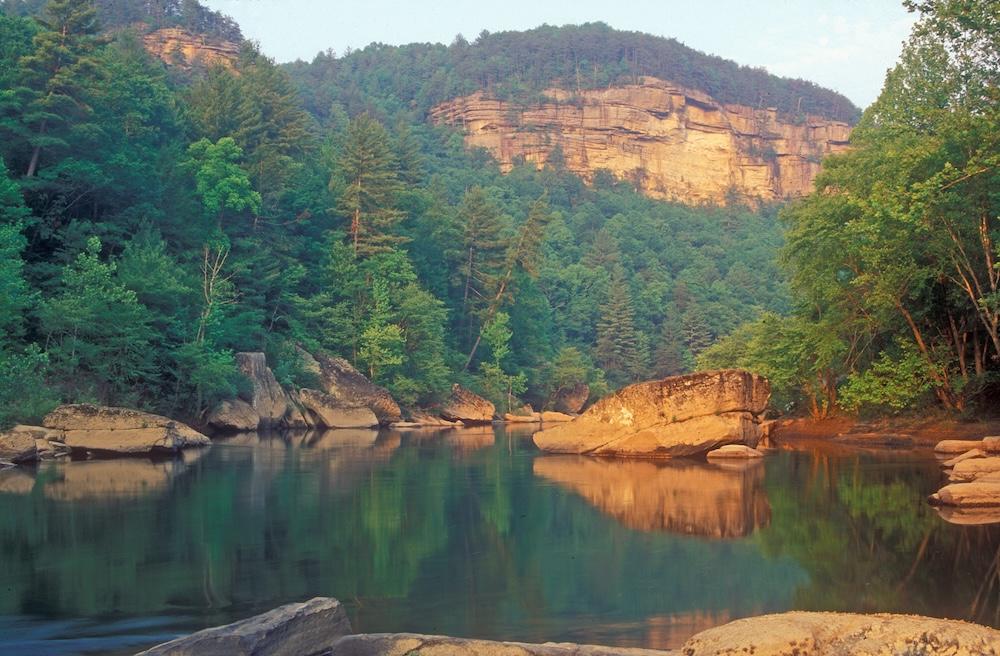 The Big South Fork River is framed against the sheer cliffs of the river gorge