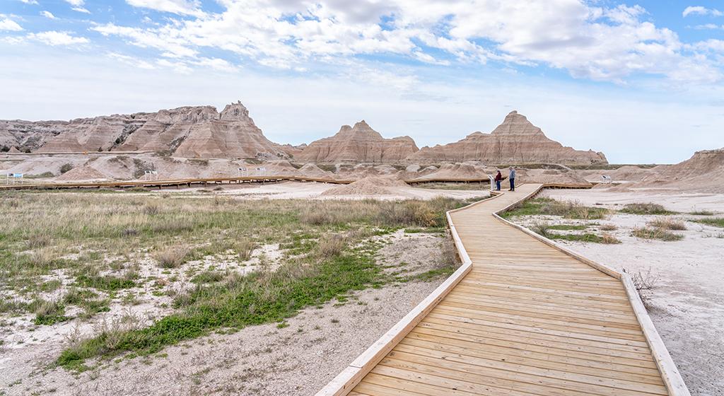 Reading the signs along the Fossil Exhibit Trail, Badlands National Park / Rebecca Latson