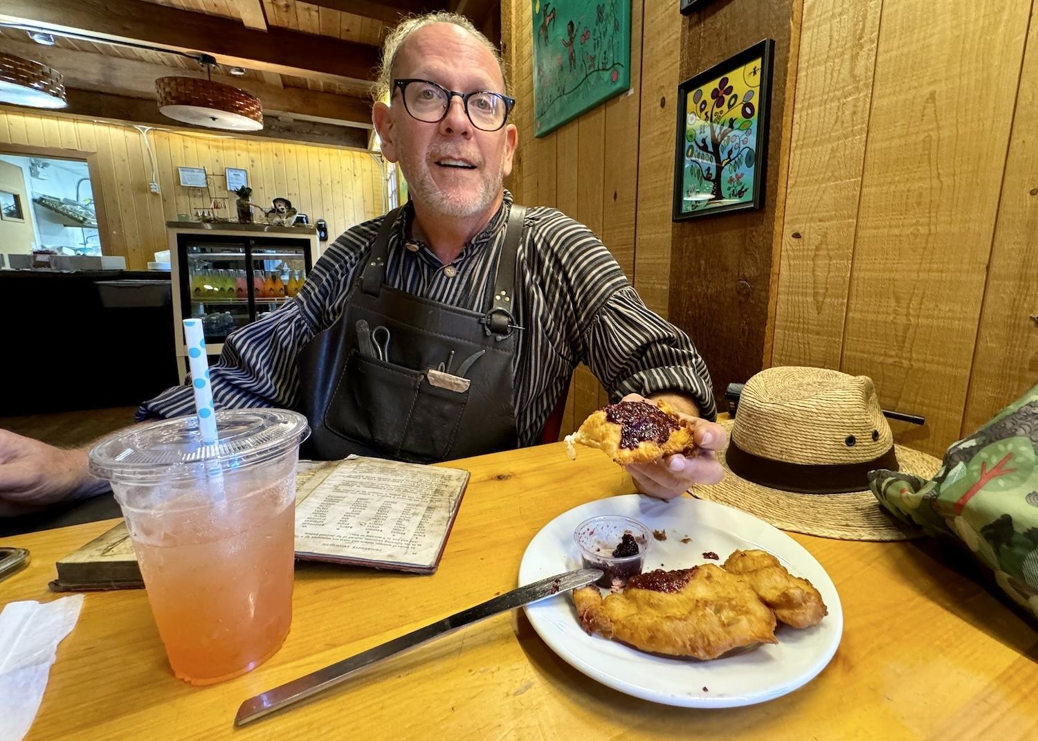 In the Ancestor Café at Fort Langley, blacksmith Danny Cram chats over bannock (an Indigenous fry bread) and jam.