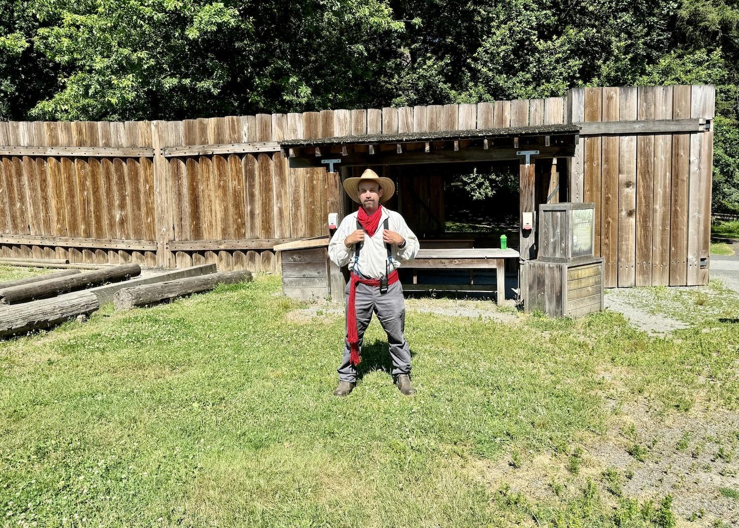 Heritage interpreter Dave Helberg gives an introduction to Fort Langley by a reconstructed "trade window."