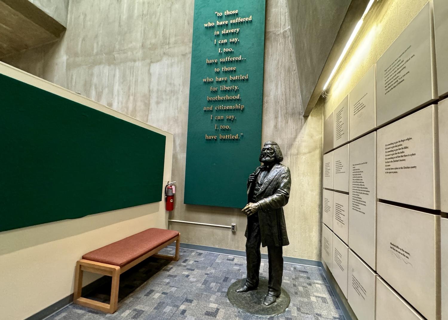 Inside the visitor center there is a statue of Frederick Douglass near a wall full of his famous quotes.