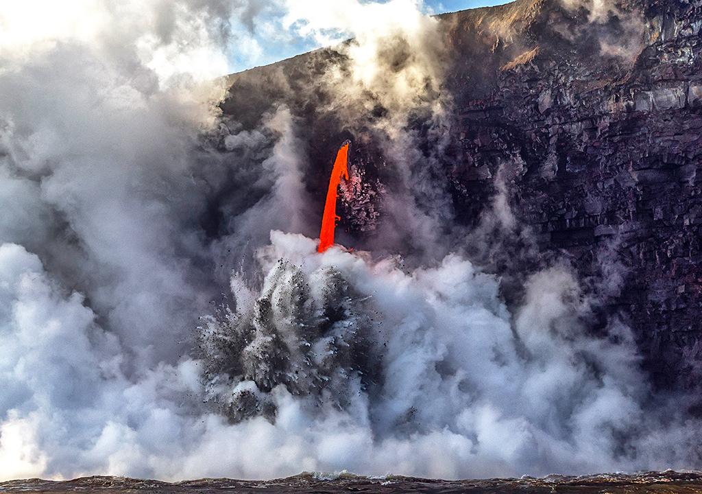 The "Firehose," an active lava tube conduit that will someday become a lava cave after the lava stops flowing or is diverted, Hawai'i Volcanoes National Park / Rebecca Latson