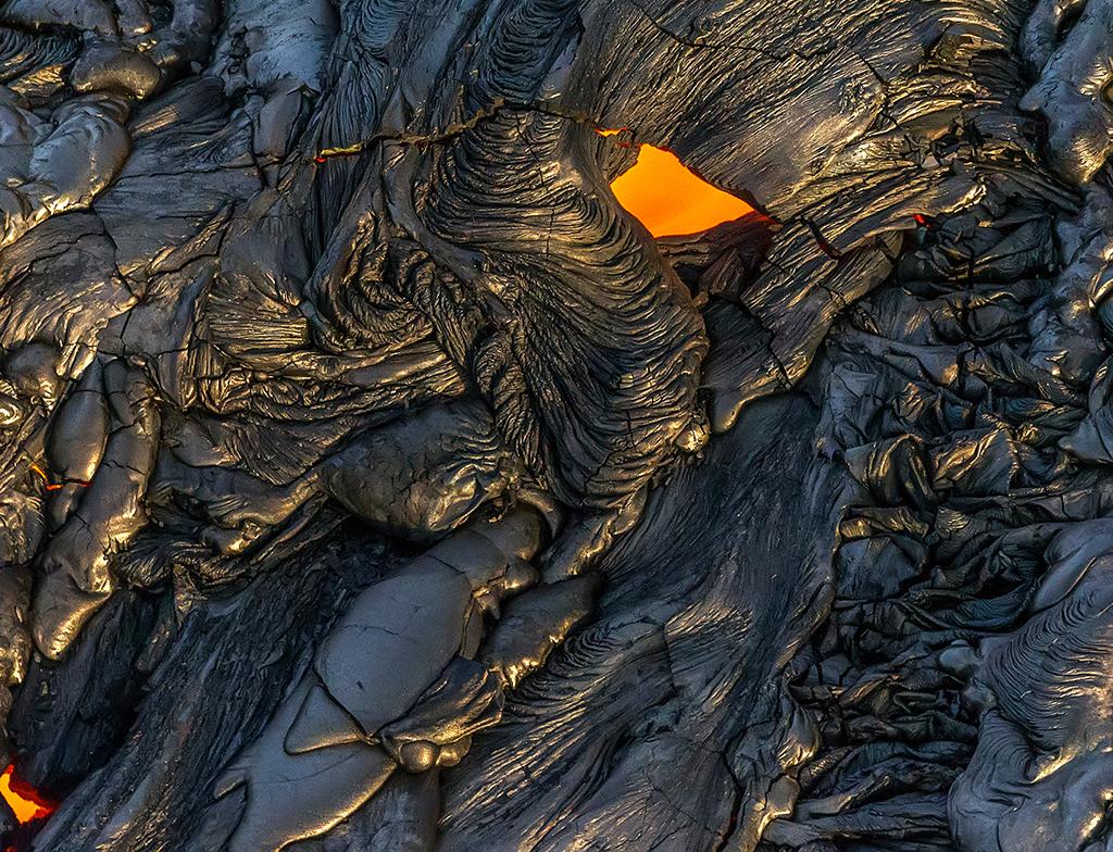 The glowing "eye" of a skylight, Hawai'i Volcanoes National Park / Rebecca Latson