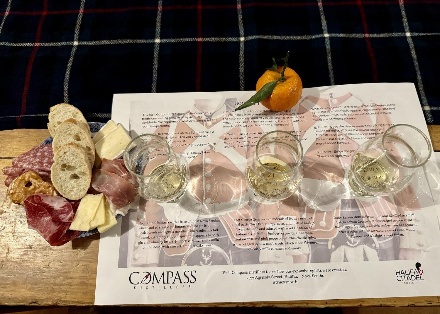 A spirits tasting comes with local charcuterie and a festive orange.