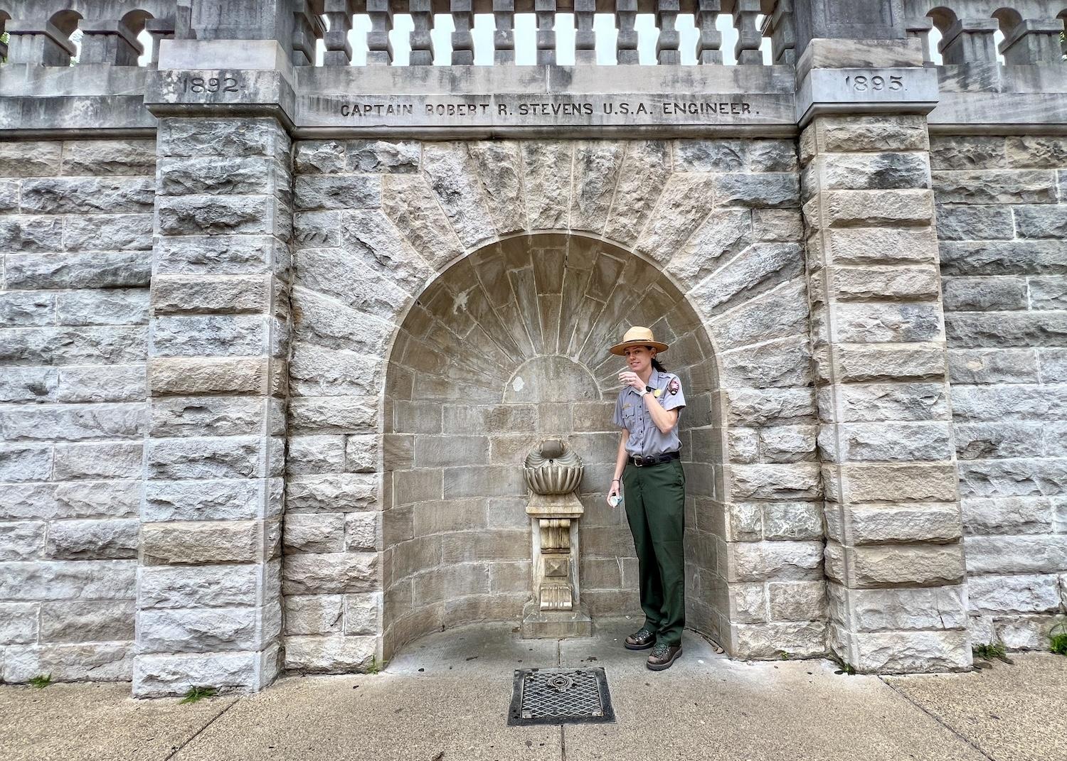 Hot Springs National Park ranger Kendra Barat offers drinks of thermal water from what's known as the "shell fountain" behind Bathhouse Row.