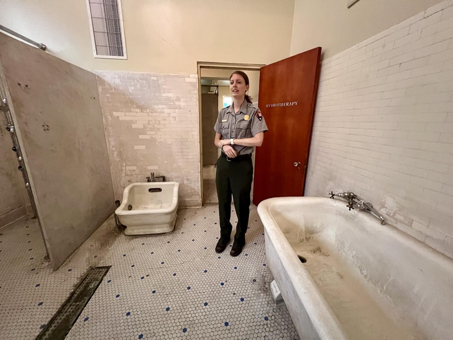 Hot Springs National Park ranger Kendra Barat shows off historic sitz and bath tubs at the Park Service's visitor center/museum in the Fordyce Bathhouse.