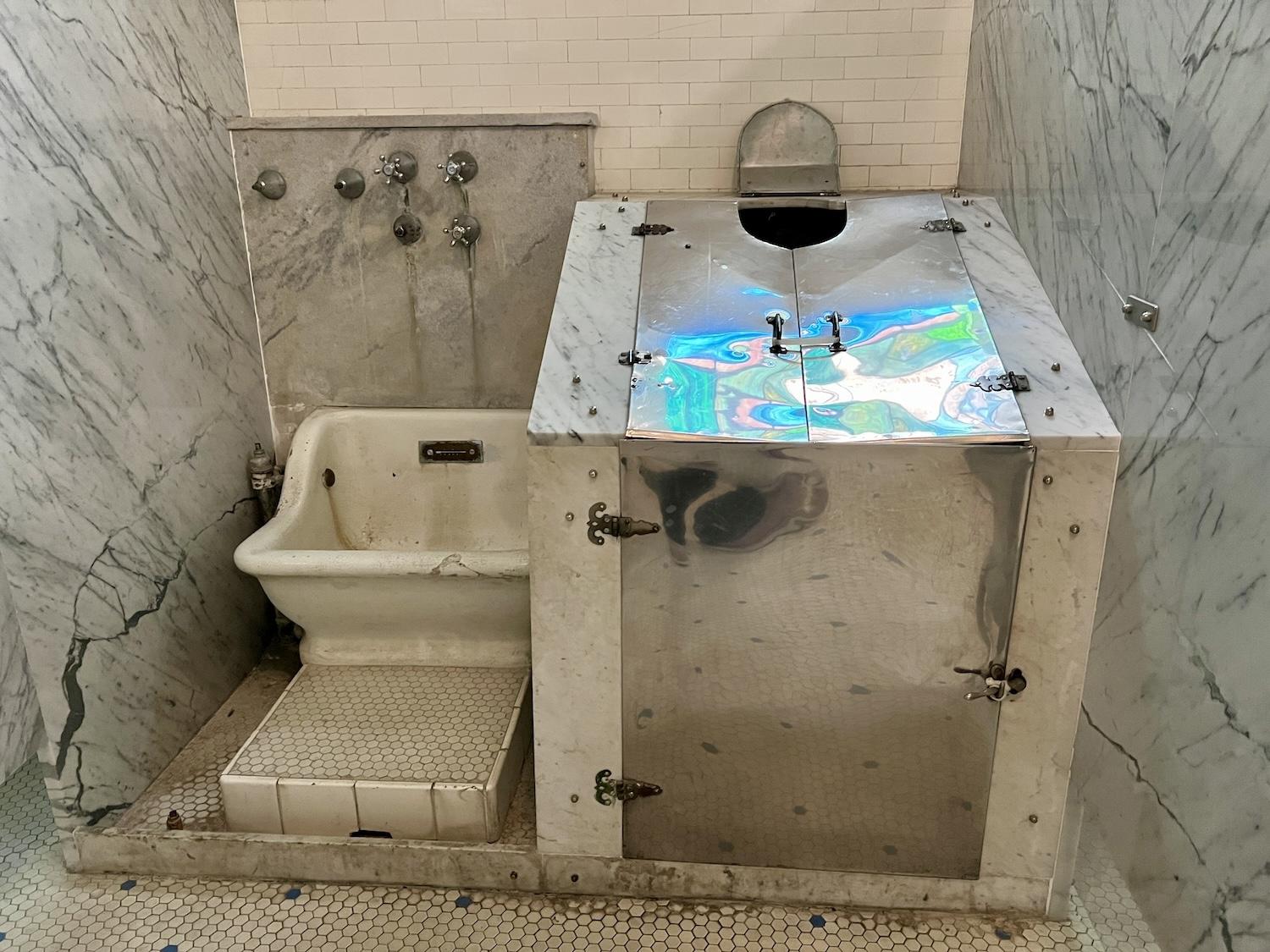 In the national park visitor center/museum at the Fordyce Bathhouse, a vintage sitz tub and head-out vapour cabinet are on display.