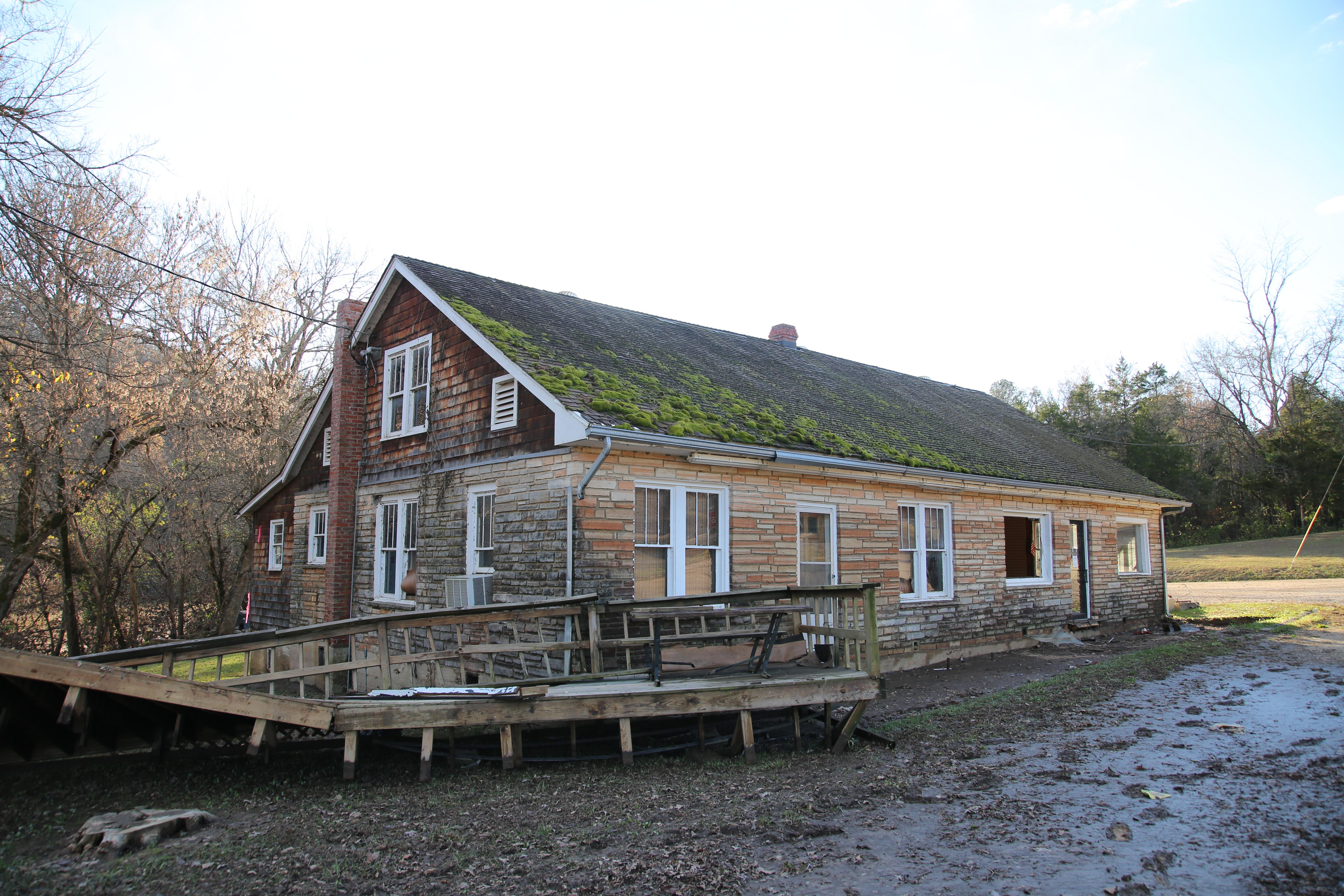 The old Akers Ferry Canoe Rental store suffered extensive damage to the building and porch / NPS