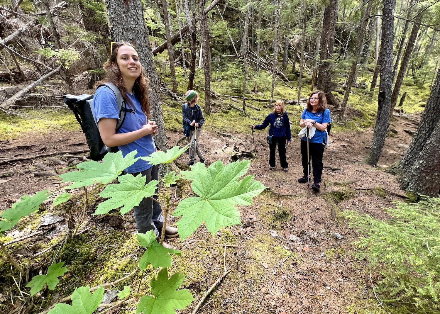 Olivia Jacobs, left, of Chilkat Guides, leads people on hikes along the U.S. start of the Chilkoot Trail in Klondike Gold Rush National Historical Park. 