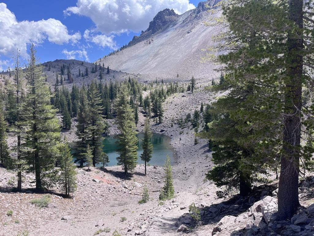 Crags Lake is reached by a modest trail not far from the Manzanita Lake campground in Lassen National Park, below the Chaos Crags area that erupted some 1,100 years ago. A subsequent dome collapse created the mass of rocks known as Chaos Jumbles.