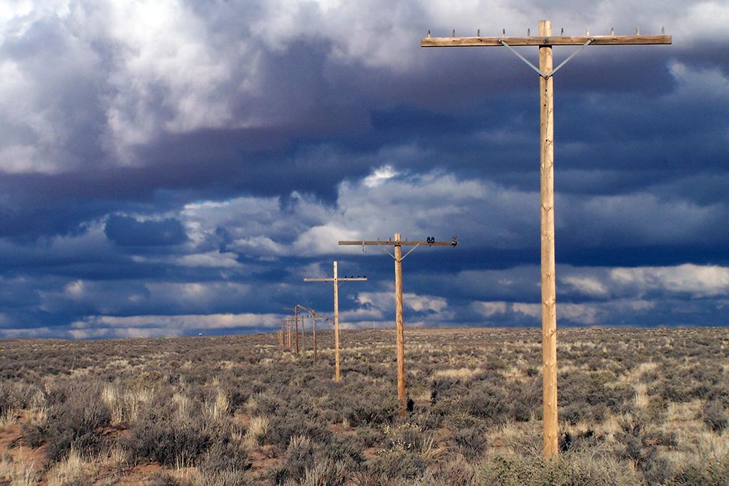 This line of telephone poles mark the road bed of Route 66 through Petrified Forest National Park / NPS file