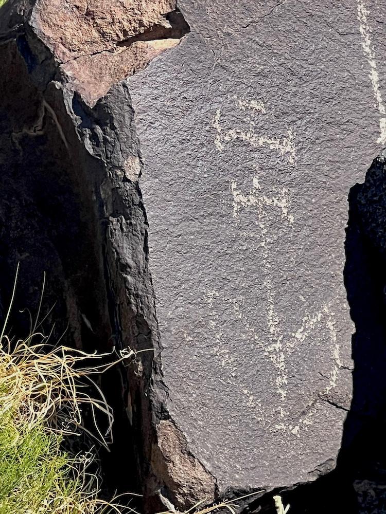  An 18th century cross carved into a rock now found in Petroglyph National Monument/Barbara Jensen