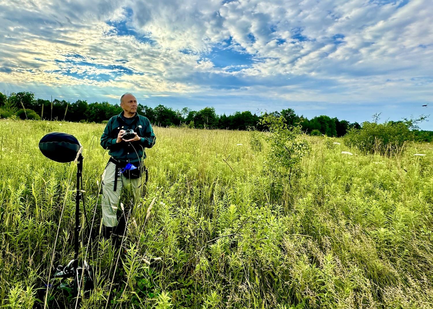 In an off-limit area of Rouge National Urban Park that attracts Bobolinks, Leonardo Cabrera sets up listening equipment.