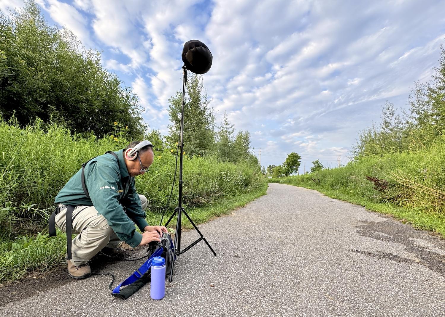 In an area of Rouge National Urban Park known for Song Sparrows, Leonardo Cabrera sets up recording equipment. 