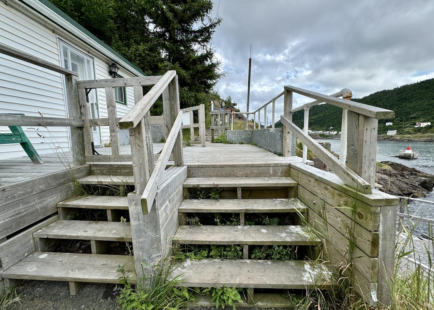 To get on or off Signal Hill's North Head Trail, you'll have to cross this Parks Canada deck attached to a private home.